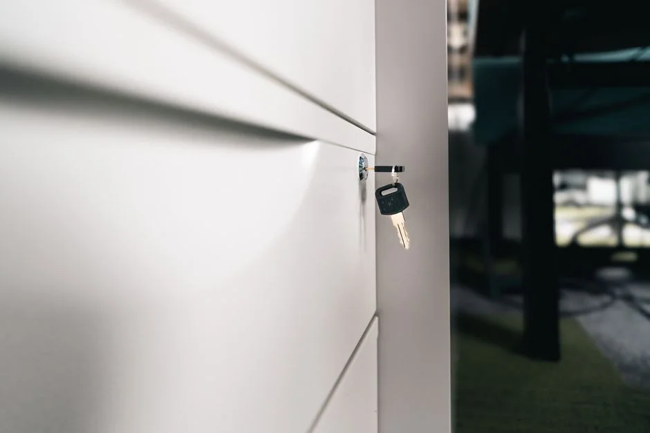 A locked office locker with a key, symbolizing a phone put away