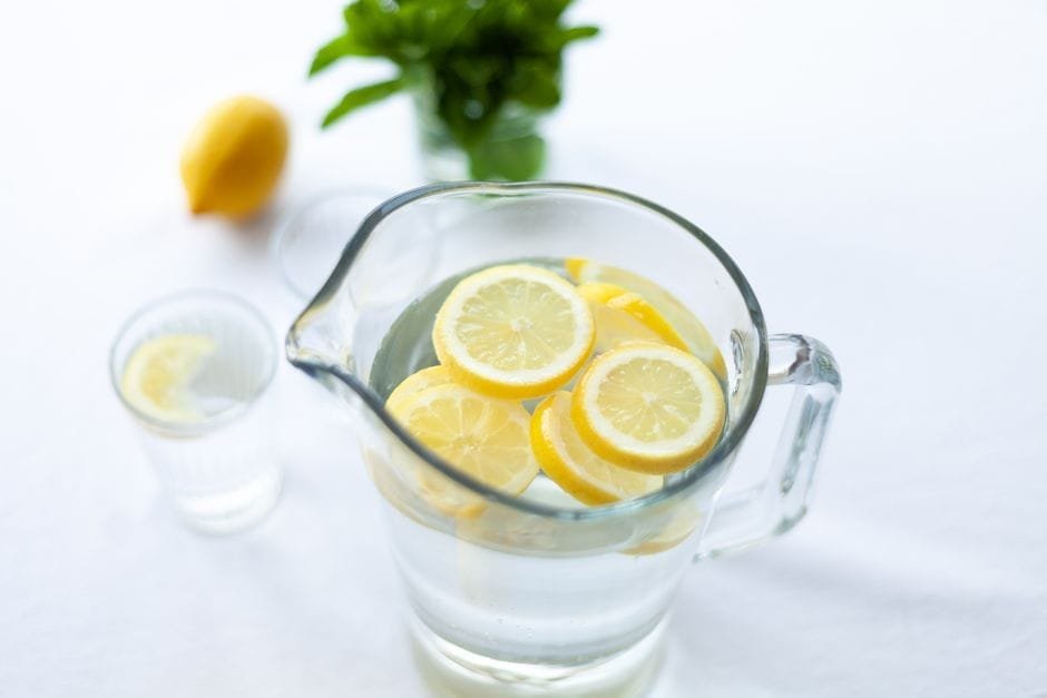 Glass of lemon water with fresh lemon slices