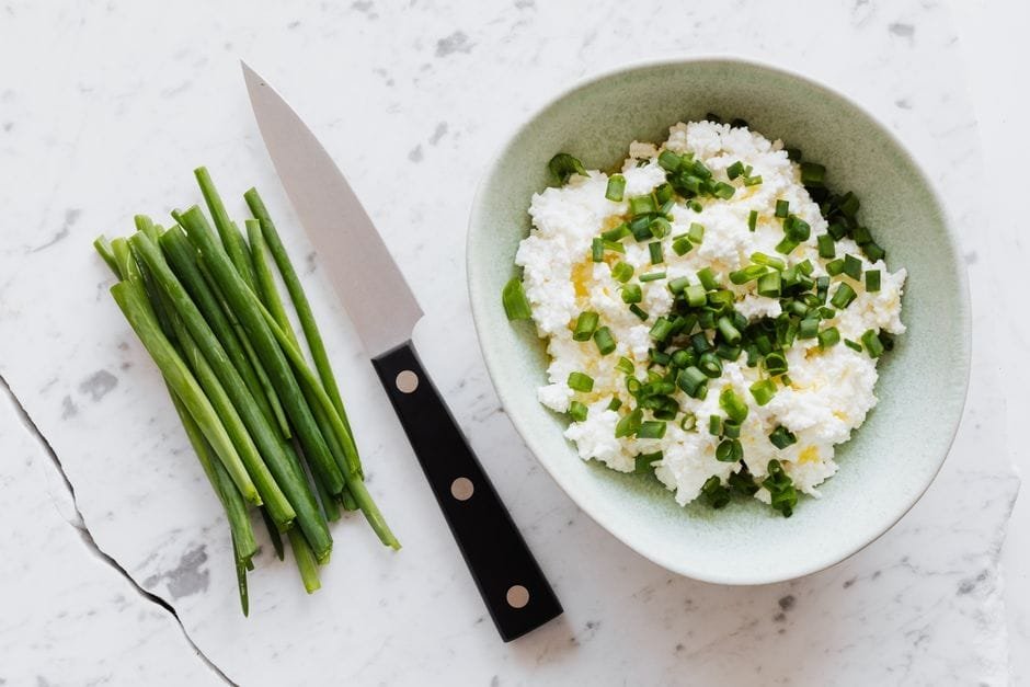 Bowl of cottage cheese on a table